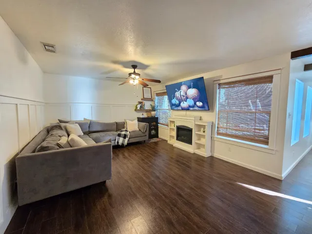 a kitchen with stainless steel appliances kitchen island granite countertop a stove a sink and a refrigerator