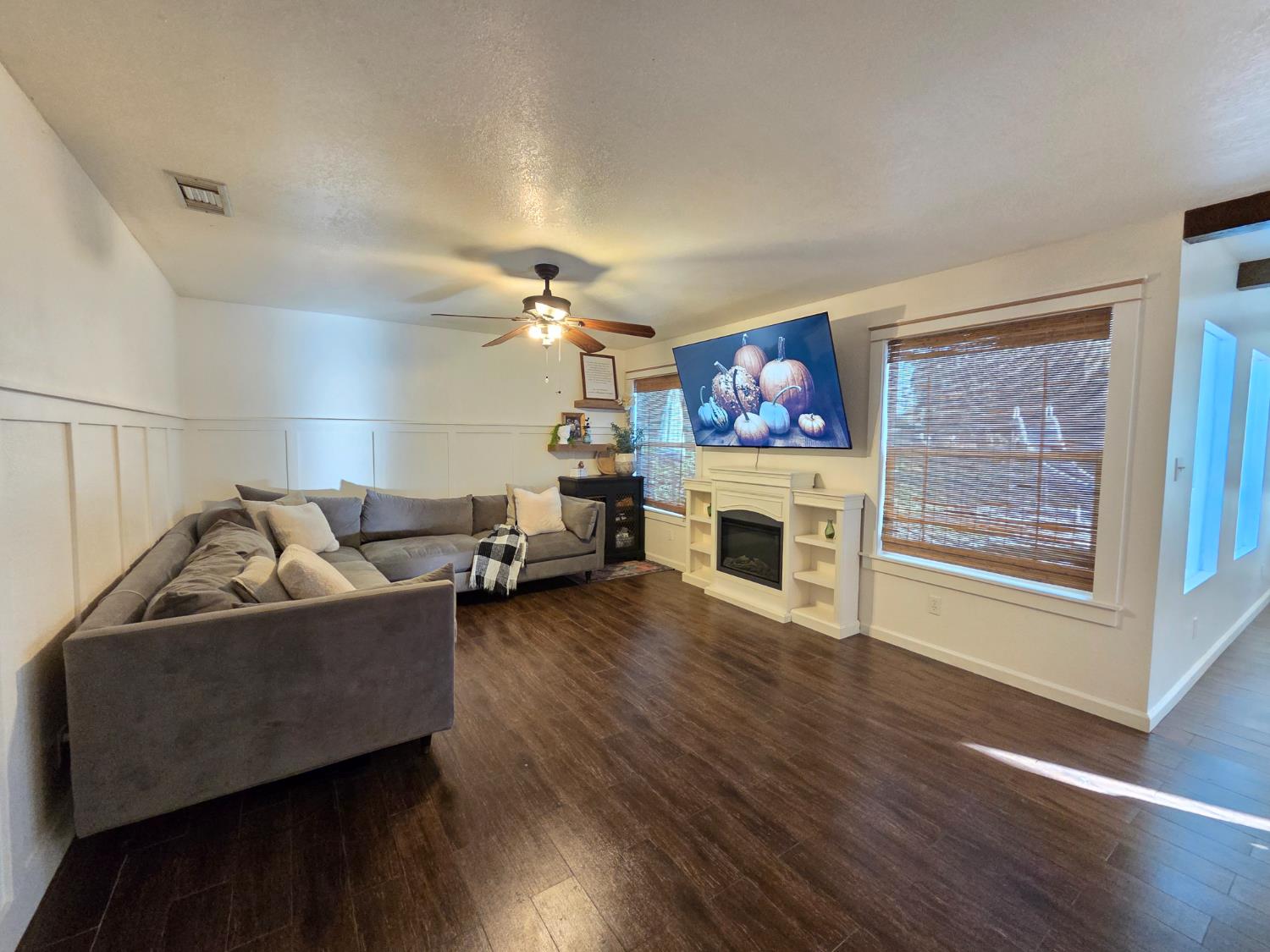 22849 East Jefferson Avenue Reedley, CA 93654 - Photo 4 of 31 a living room with furniture and a fireplace