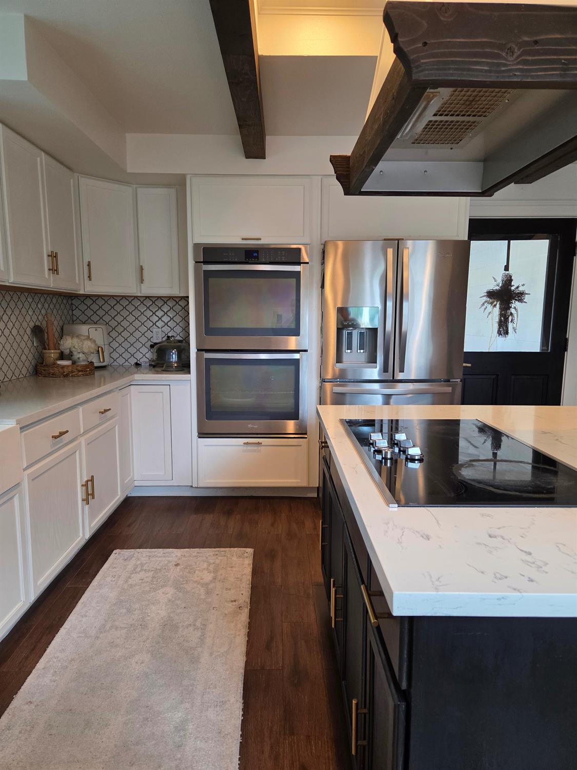 22849 East Jefferson Avenue Reedley, CA 93654 - Photo 9 of 31 a kitchen with granite countertop a stove and a sink