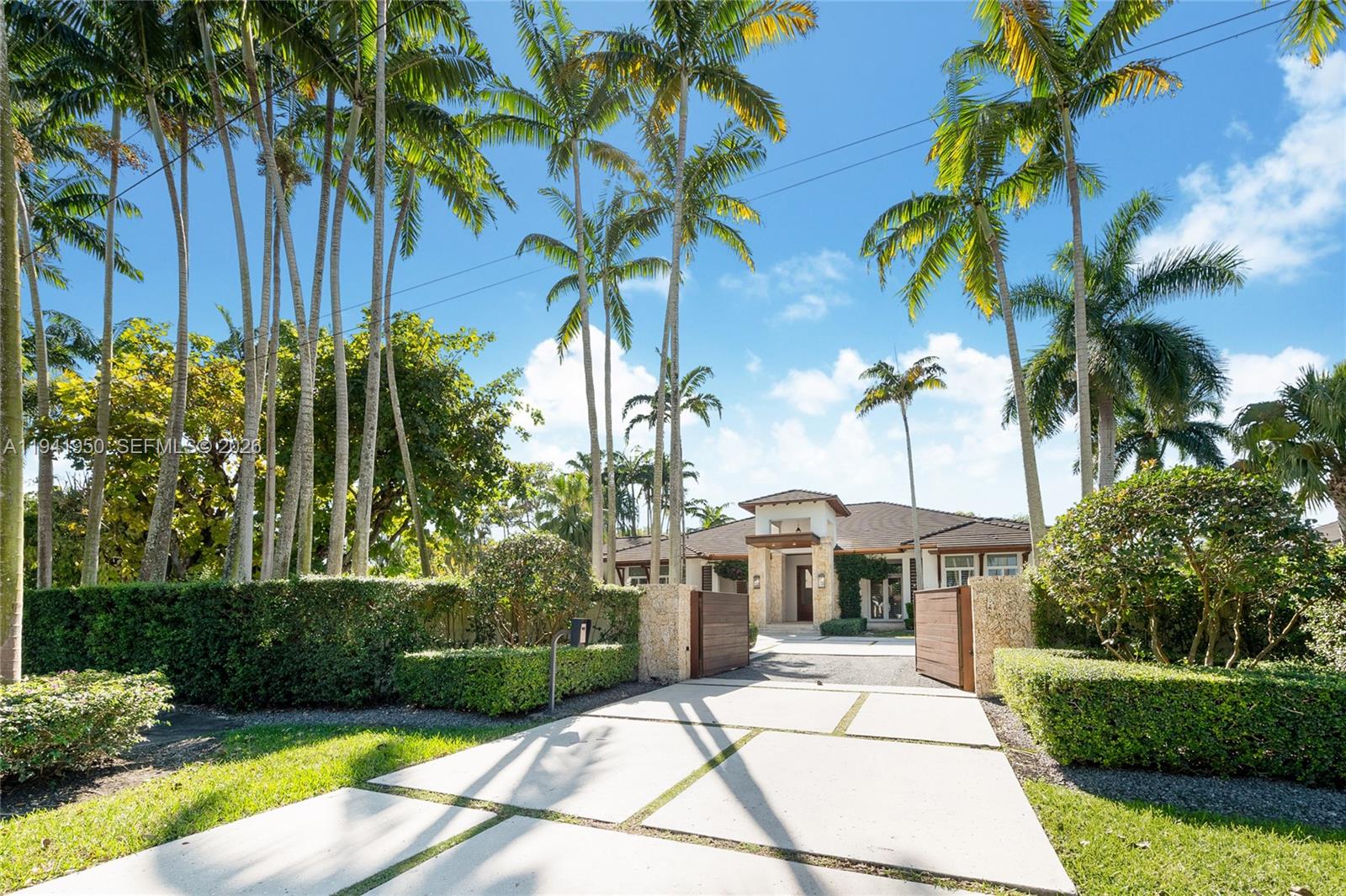 a view of a backyard with a garden and patio