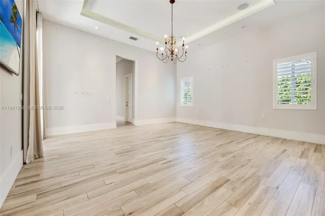 a spacious bathroom with a bathtub shower and sink