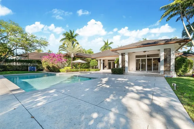 a front view of house with yard and outdoor seating