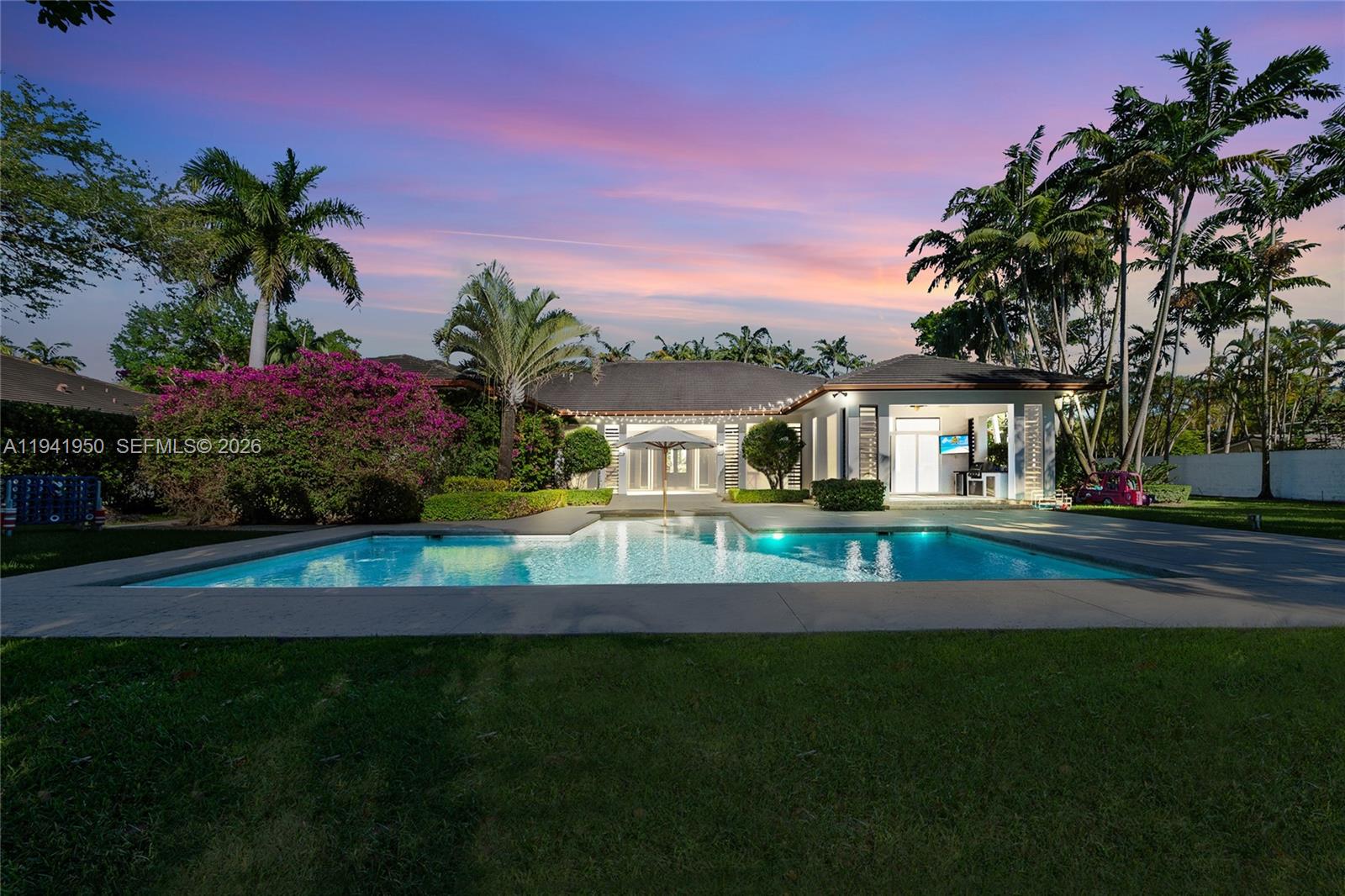 6880 Southwest 82nd Avenue Miami, FL 33143 - Photo 29 of 29 a front view of house with yard and outdoor seating