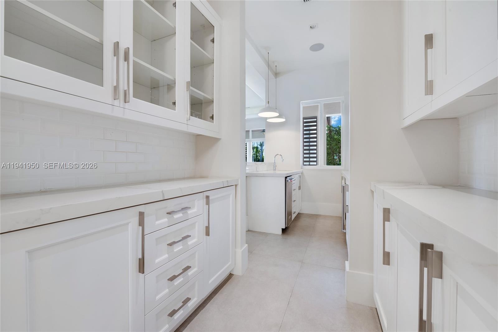 6880 Southwest 82nd Avenue Miami, FL 33143 - Photo 8 of 29 a kitchen with cabinets and window