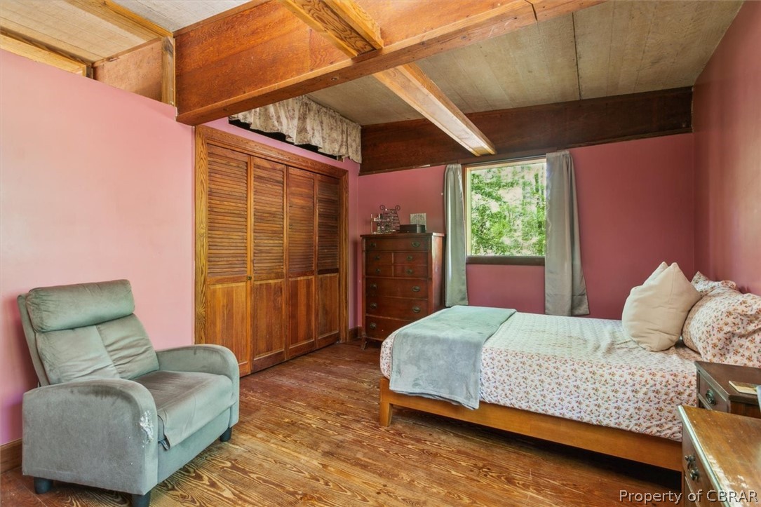 4544 Piney Swamp Road Hayes, VA 23072 - Photo 26 of 48 Bedroom with a closet, hardwood / wood-style floors, and beam ceiling
