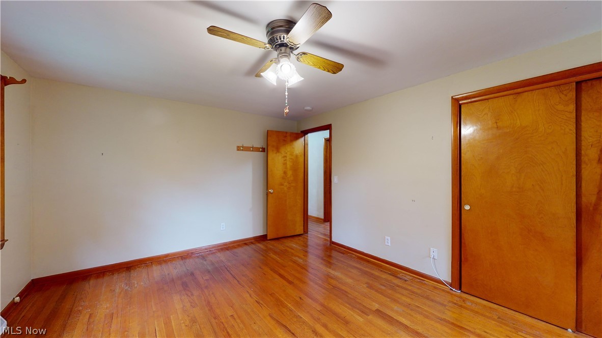 6400 Brookside Road Independence, OH 44131 - Photo 36 of 47 Unfurnished bedroom with hardwood / wood-style flooring, a closet, and ceiling fan