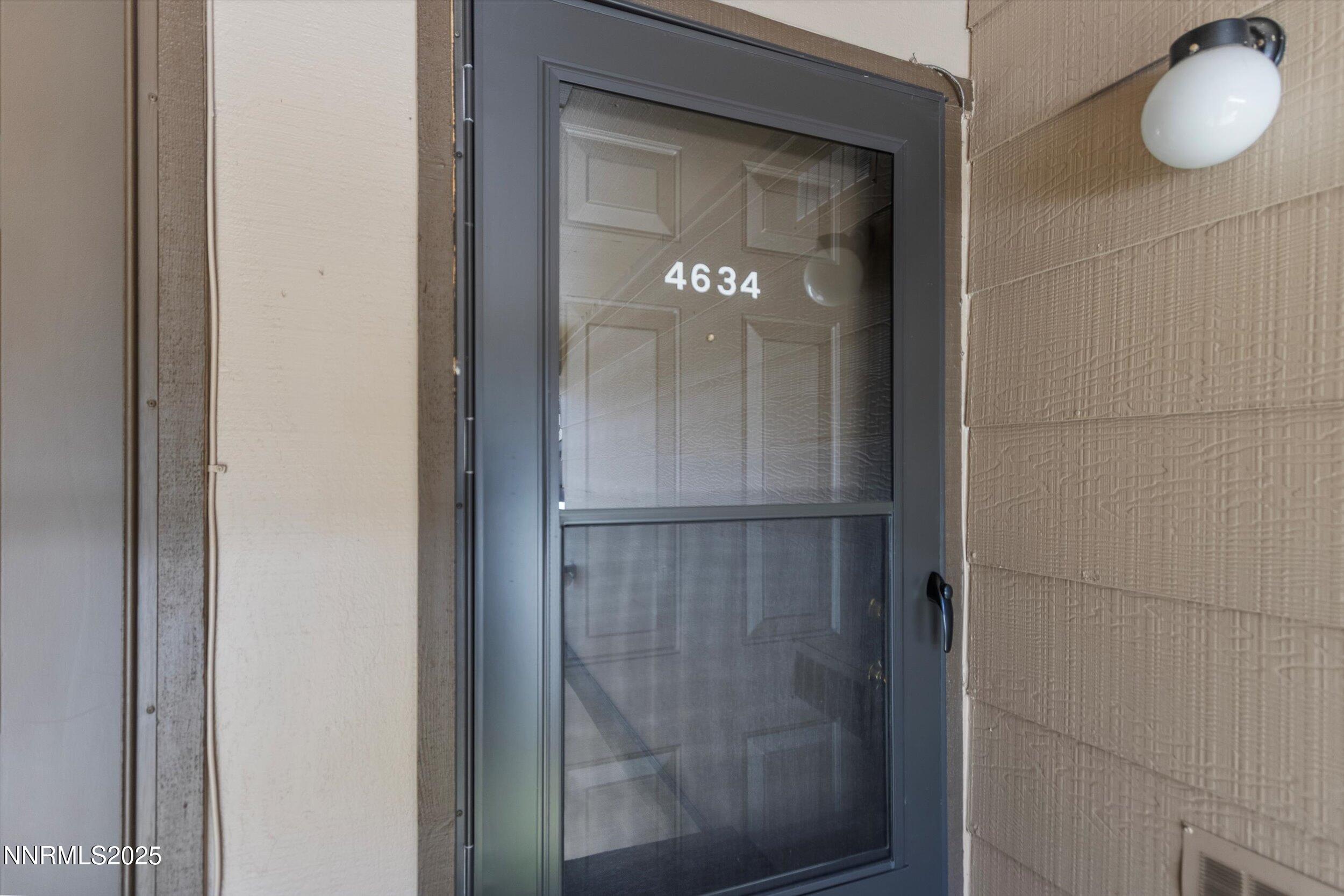 4634 Rio Poco Road Reno, NV 89502 - Photo 3 of 24 a bathroom with a glass shower door and vanity