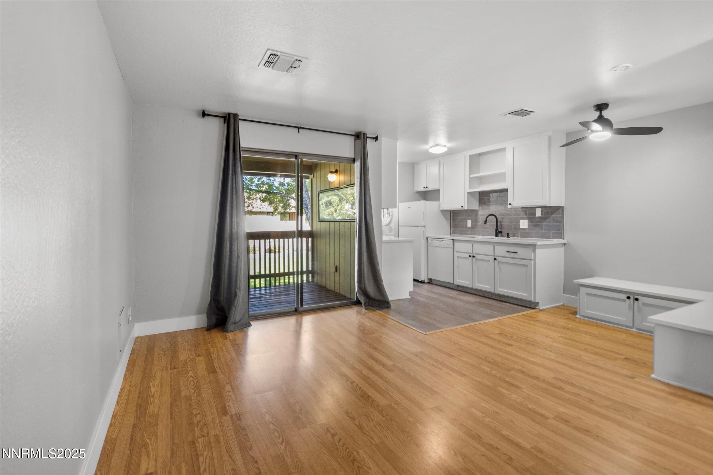 4634 Rio Poco Road Reno, NV 89502 - Photo 5 of 24 a kitchen with a sink and wooden floor
