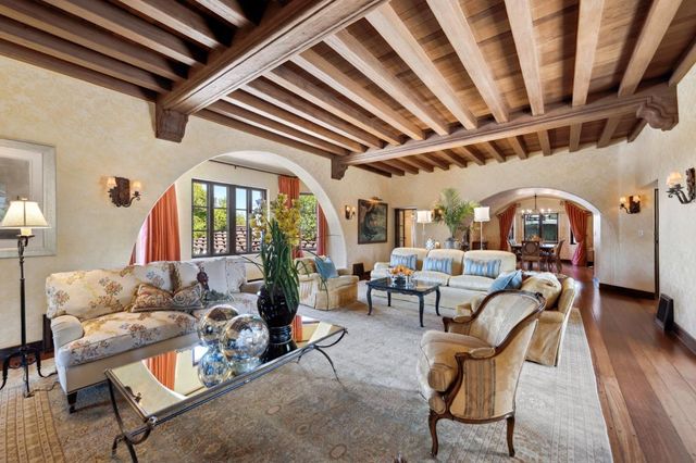 a bathroom with a granite countertop double vanity sink and a mirror