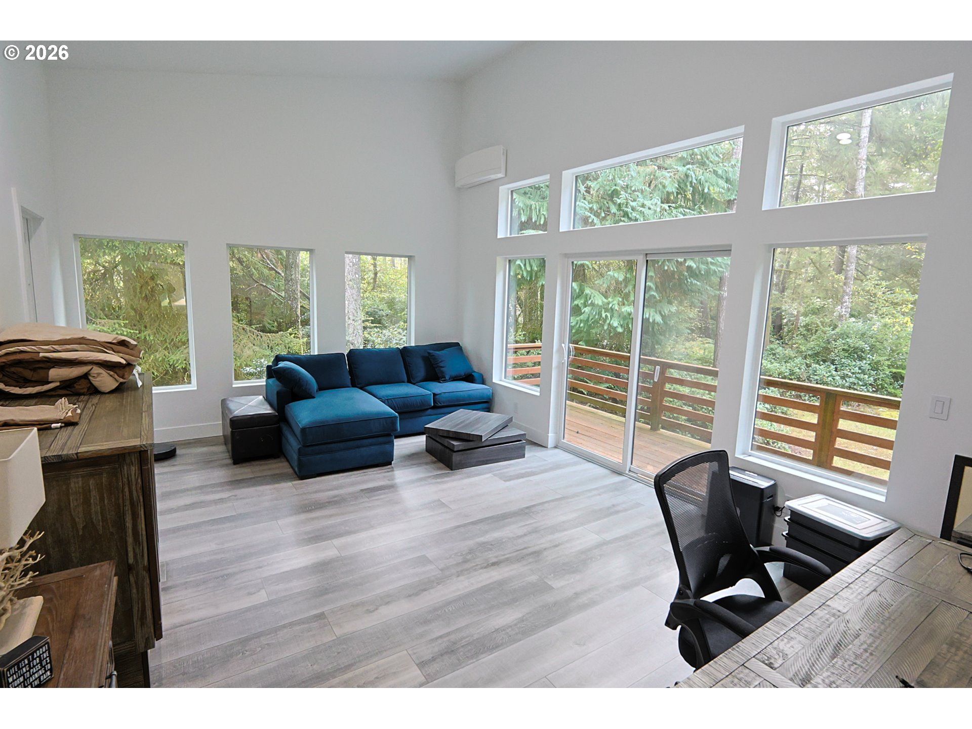 59492 Seven Devils Road Bandon, OR 97411 - Photo 33 of 48 a living room with furniture and a floor to ceiling window