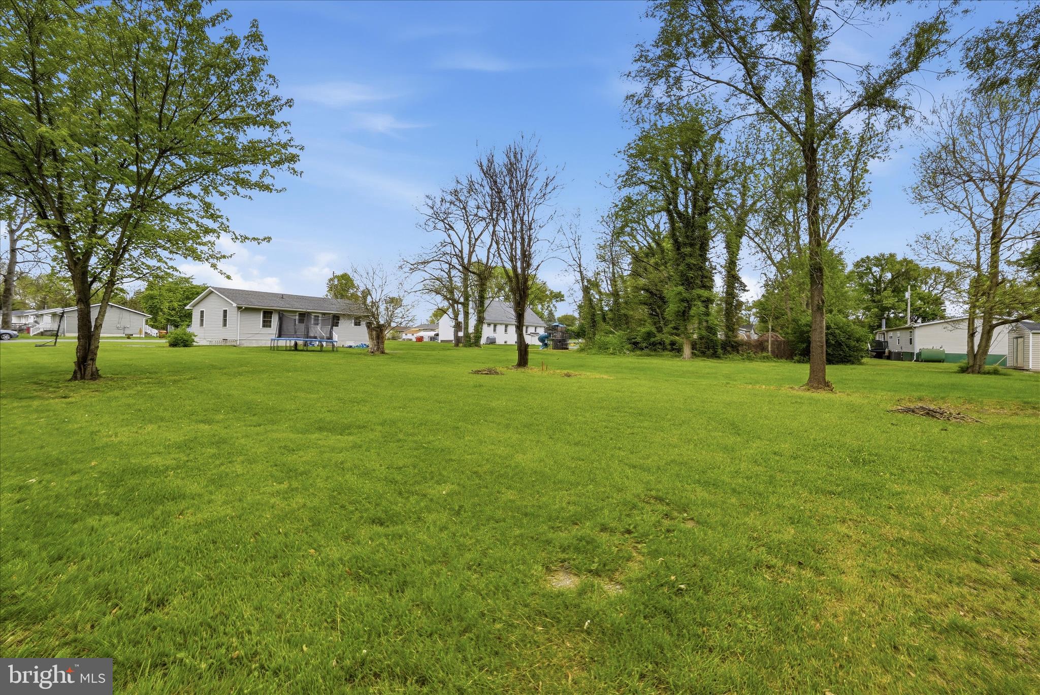 415 McDonald Street Ranson, WV 25438 - Photo 3 of 16 a view of a grassy field with trees