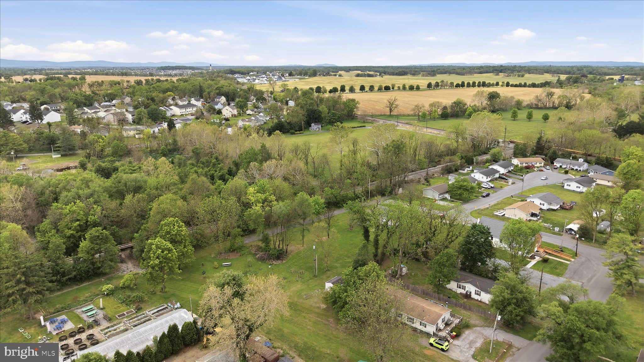 415 McDonald Street Ranson, WV 25438 - Photo 9 of 16 an aerial view of residential houses with outdoor space and trees