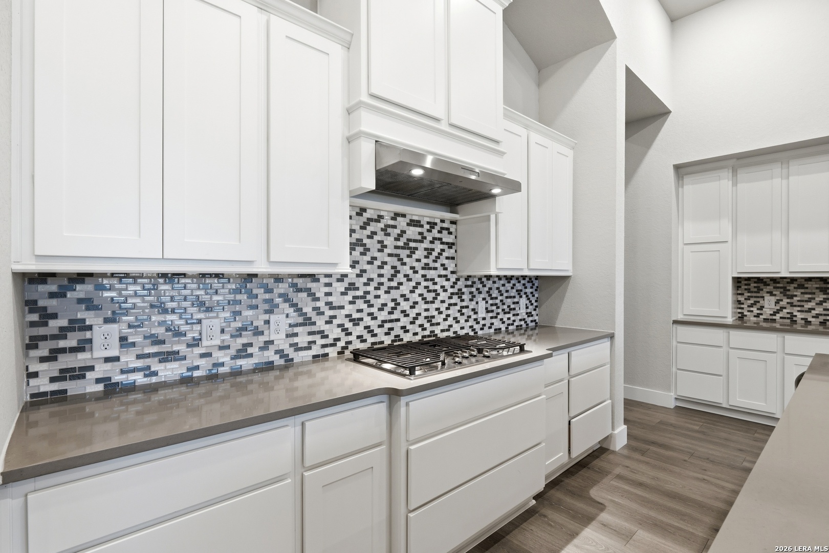 3018 Daplyn Bulverde, TX 78163 - Photo 12 of 36 a kitchen with granite countertop white cabinets and white appliances