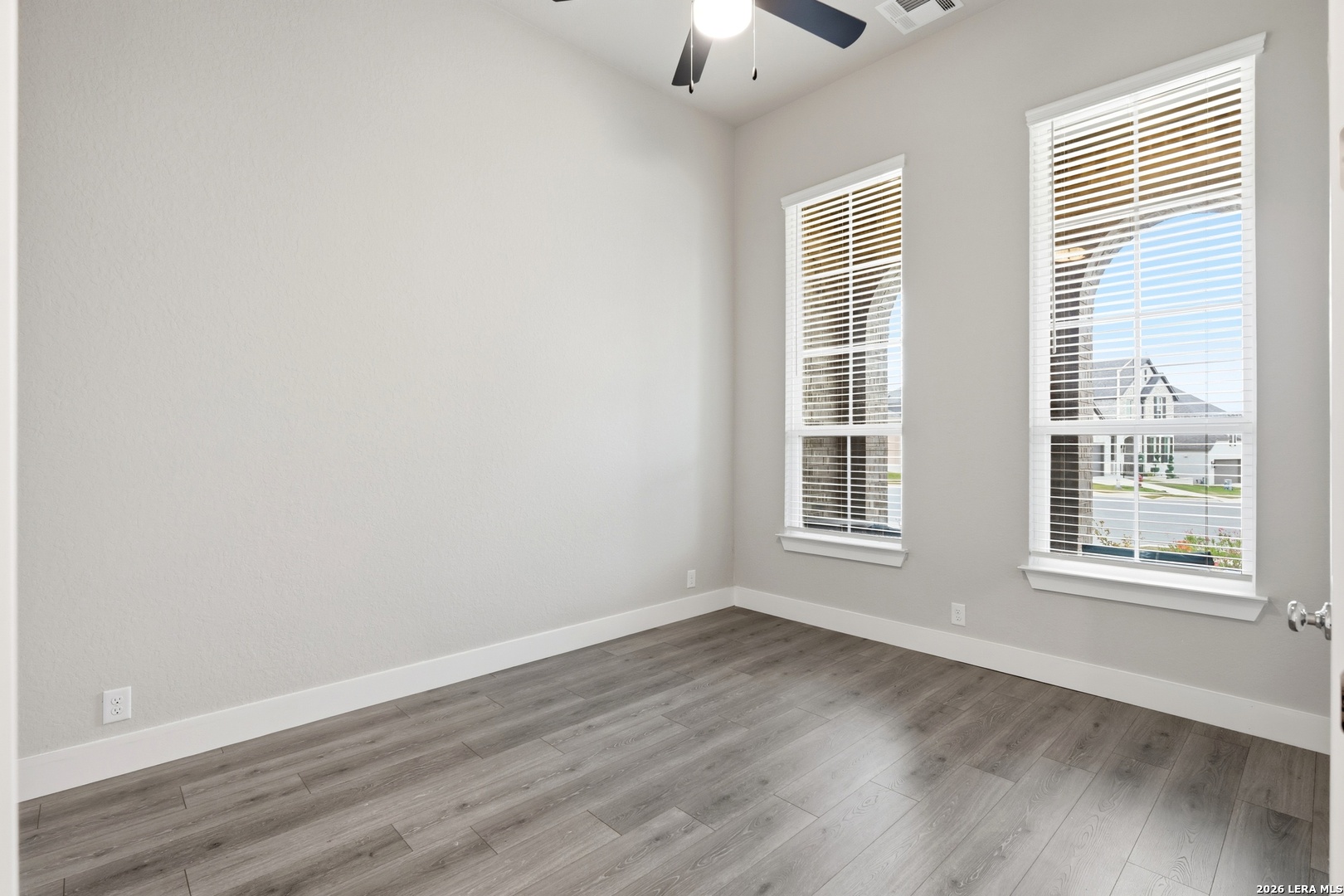 3018 Daplyn Bulverde, TX 78163 - Photo 13 of 36 a view of an empty room with wooden floor and a window