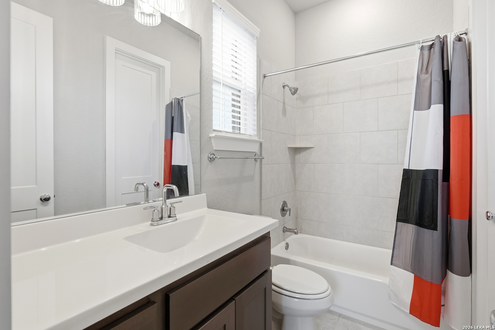 3018 Daplyn Bulverde, TX 78163 - Photo 15 of 36 a bathroom with a sink a toilet a mirror a vanity and shower