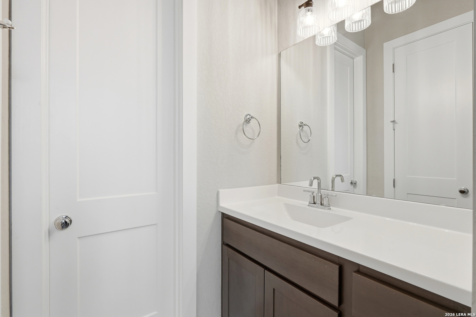 3018 Daplyn Bulverde, TX 78163 - Photo 23 of 36 a bathroom with a sink and a mirror