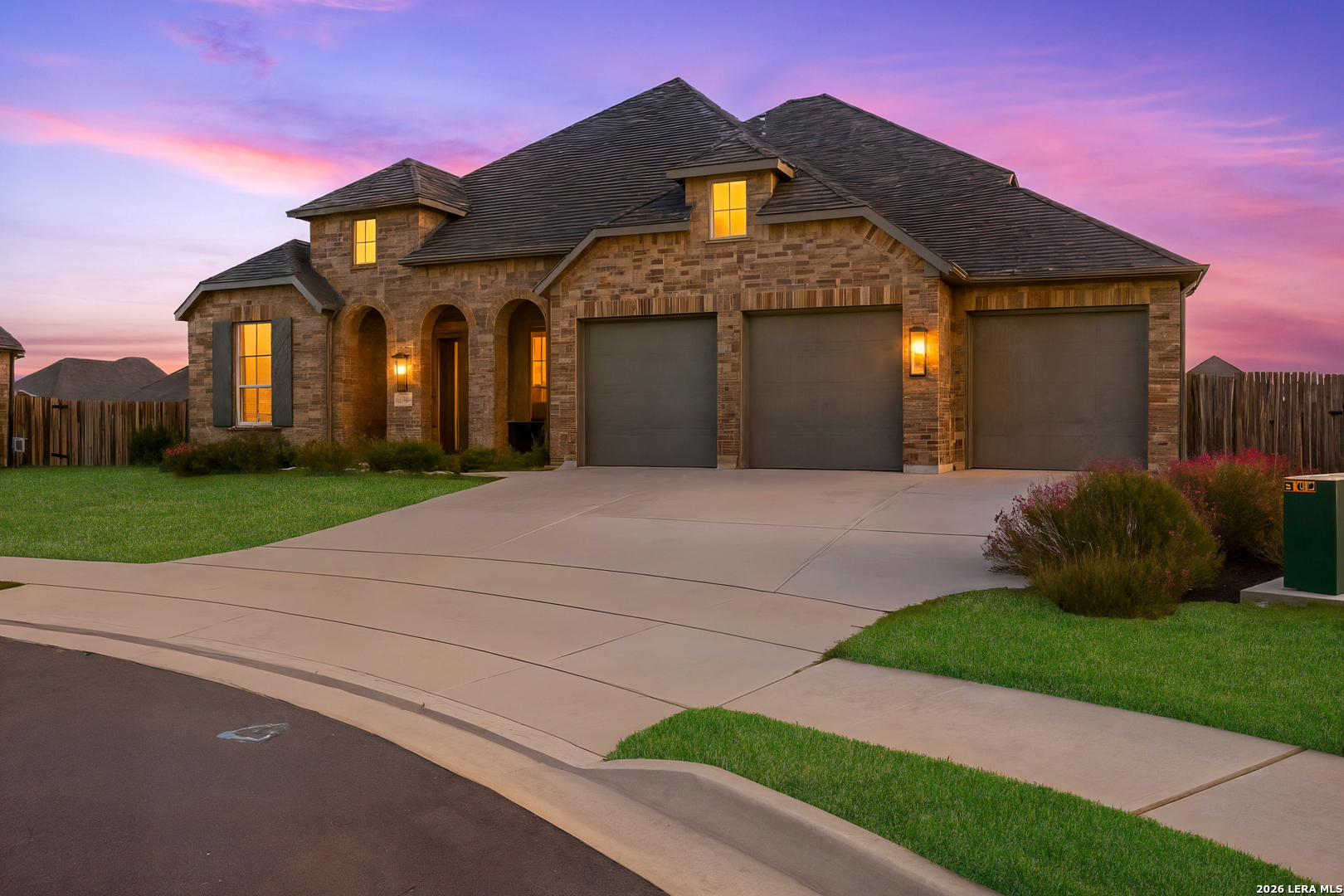 3018 Daplyn Bulverde, TX 78163 - Photo 33 of 36 a front view of a house with a yard and potted plants