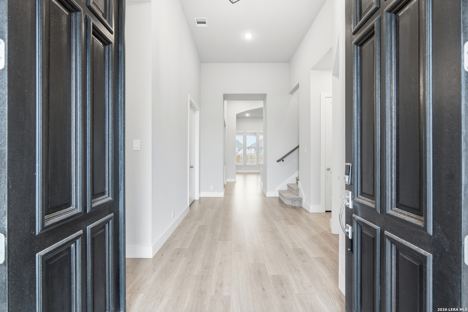 3018 Daplyn Bulverde, TX 78163 - Photo 5 of 36 a view of a hallway with wooden floor and staircase