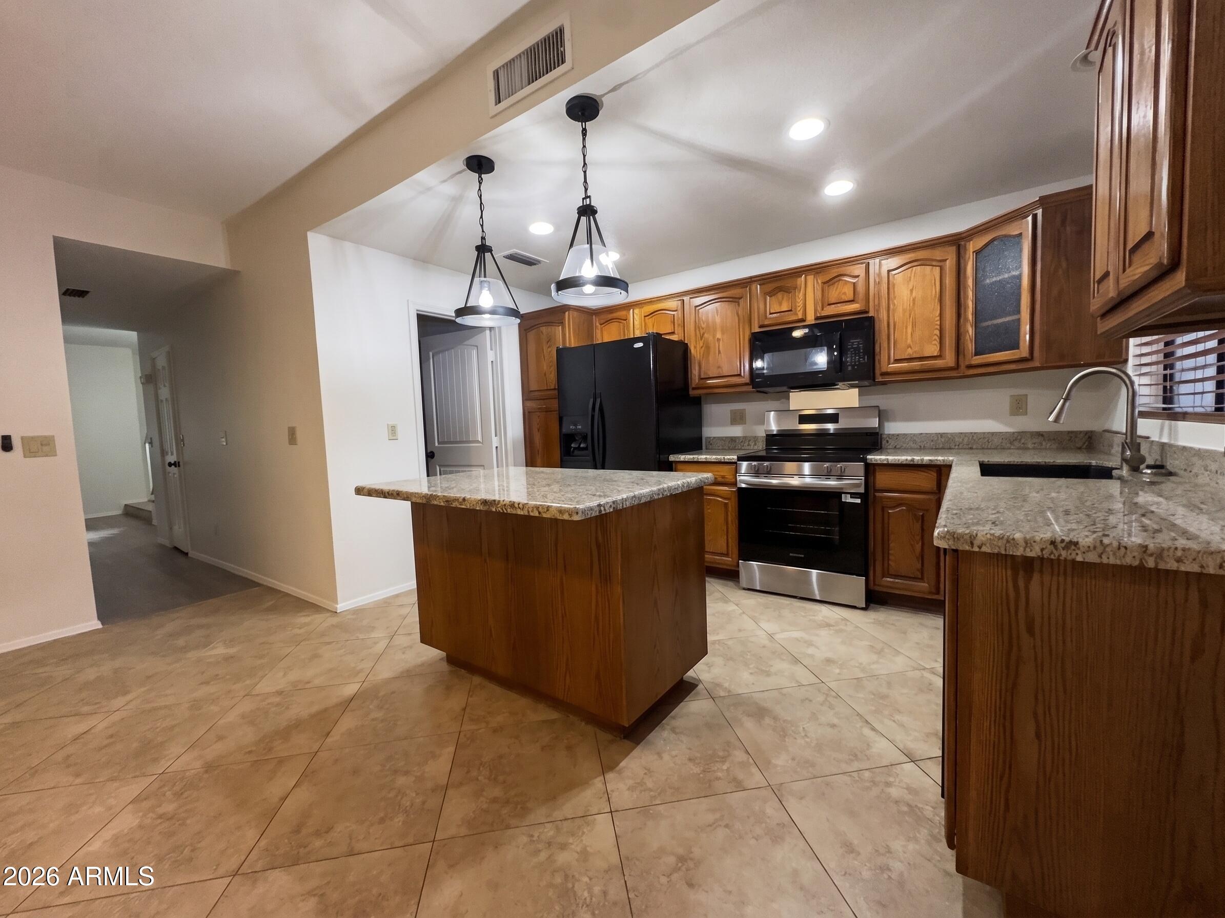 170 East Guadalupe Road, Unit 142 Gilbert, AZ 85234 - Photo 10 of 32 10 - Kitchen to bathroom