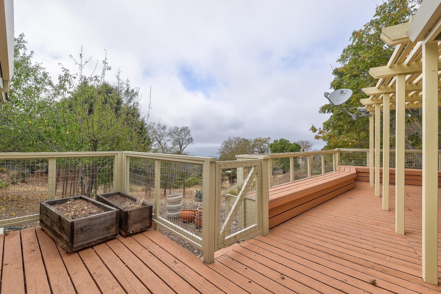 20143 Beatty Ridge Road Los Gatos, CA 95033 - Photo 19 of 21 a view of a balcony with two chairs and wooden floor