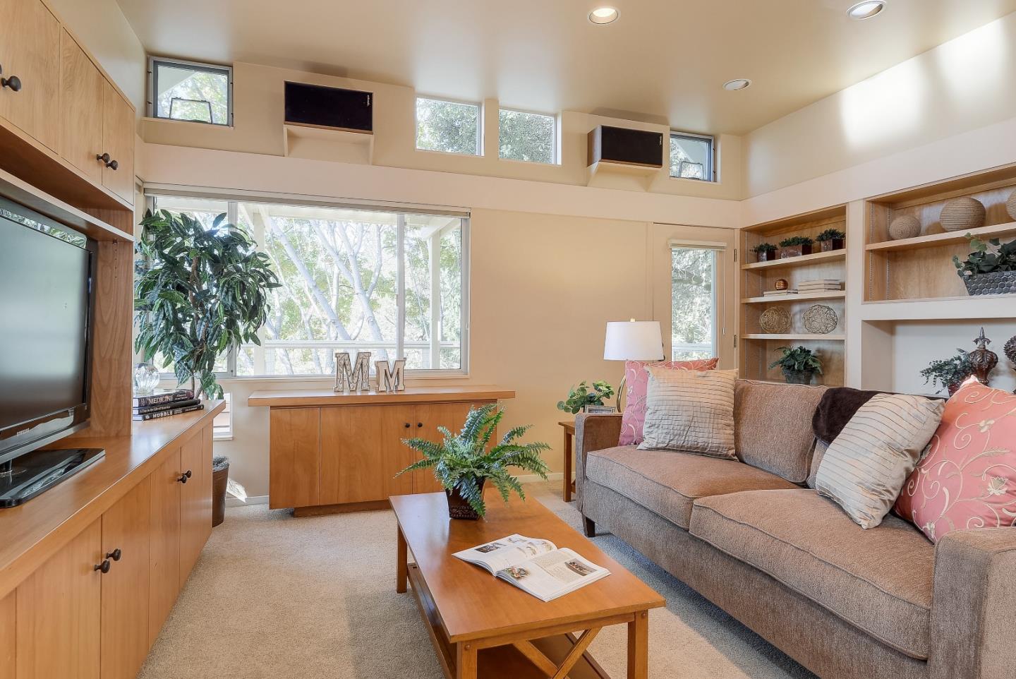 20143 Beatty Ridge Road Los Gatos, CA 95033 - Photo 5 of 21 a living room with furniture and a flat screen tv