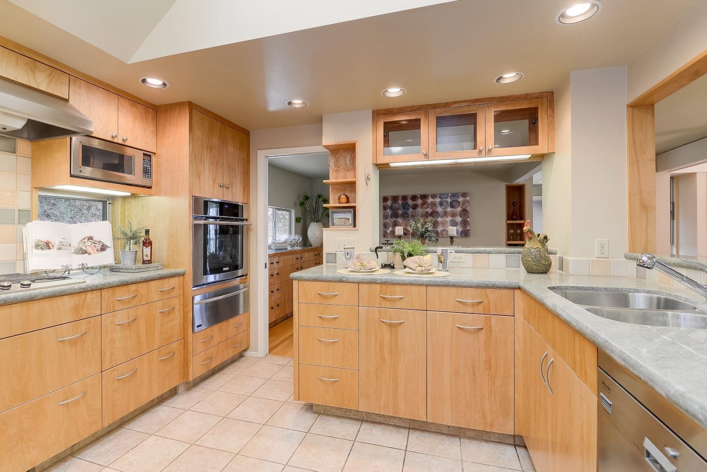 20143 Beatty Ridge Road Los Gatos, CA 95033 - Photo 6 of 21 a kitchen with stainless steel appliances granite countertop a sink and cabinets