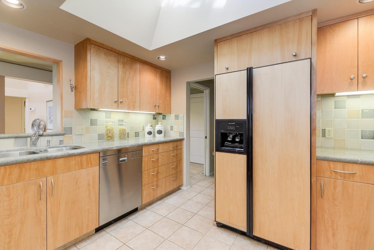20143 Beatty Ridge Road Los Gatos, CA 95033 - Photo 7 of 21 a kitchen with stainless steel appliances granite countertop a refrigerator and a sink