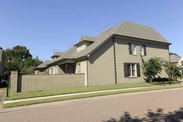 a view of a backyard with sitting area