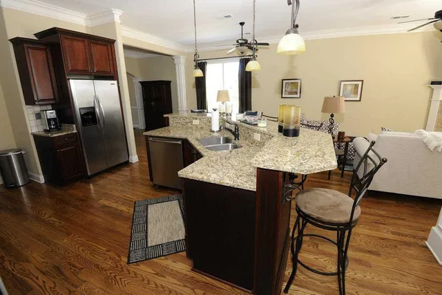 a kitchen with wooden cabinets and sink