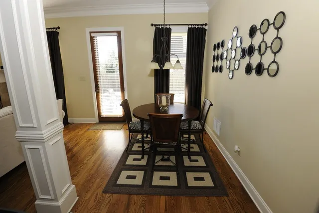 a kitchen with stainless steel appliances kitchen island granite countertop a stove a refrigerator and cabinets