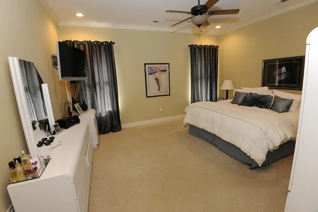 a view of a hallway with furniture and wooden floor