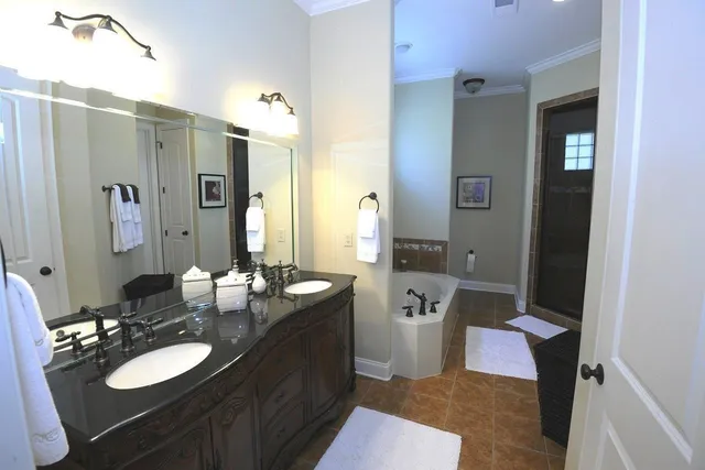 a bedroom with a bed closet and flat screen tv