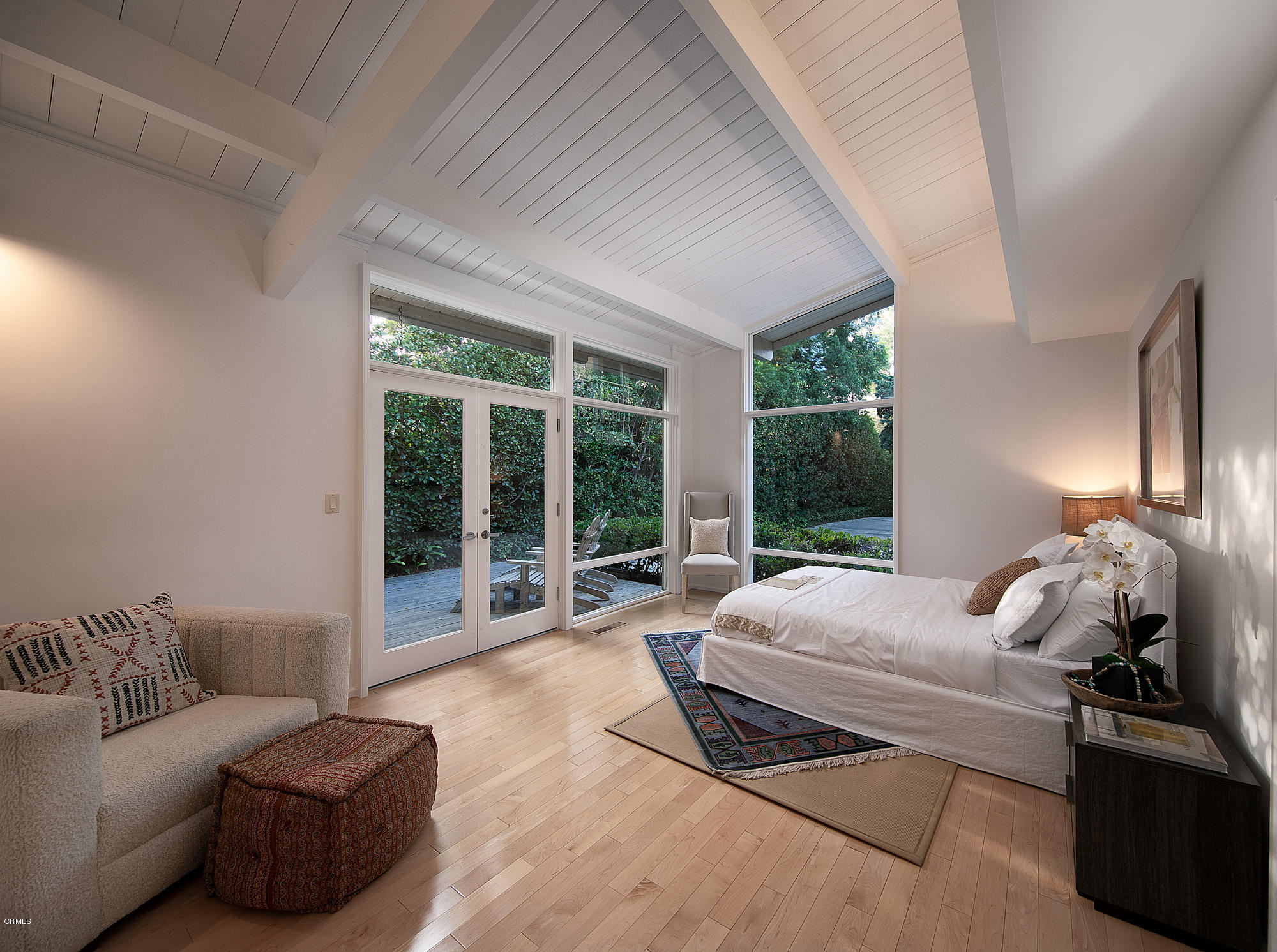 28946 Cliffside Drive Malibu, CA 90265 - Photo 19 of 29 a bedroom with a bed and glass window