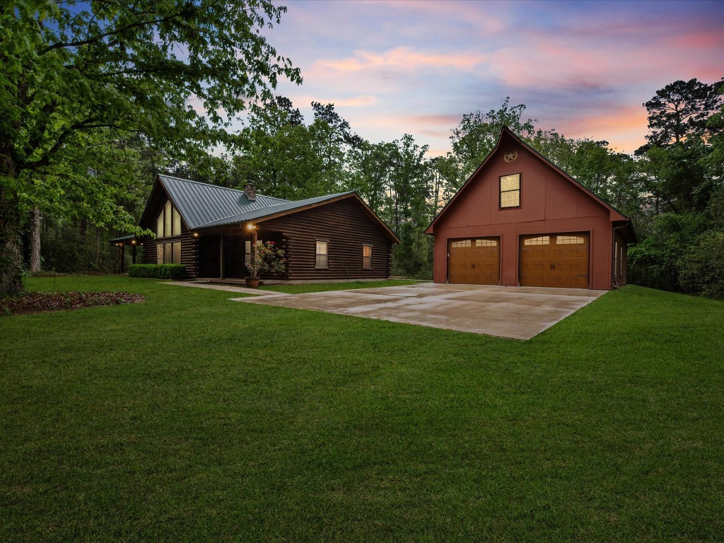 12868 Levi Road Willis, TX 77378 - Photo 2 of 41 Peaceful country living on 10 acres with a charming log home, detached garage, and room to roam.