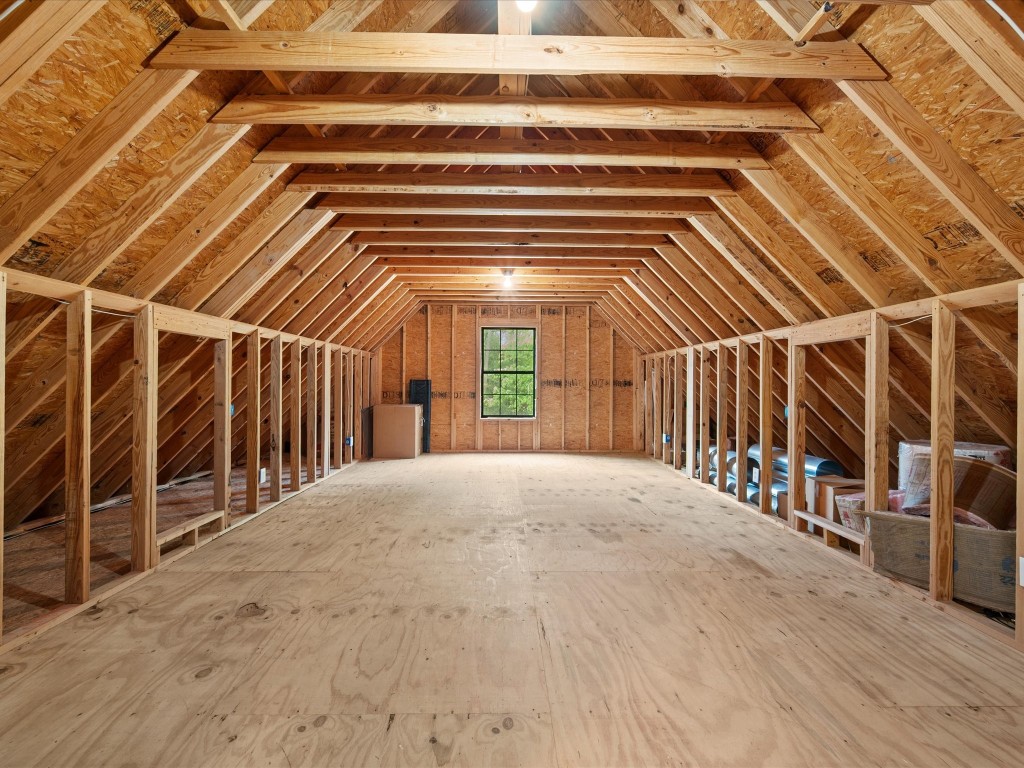 12868 Levi Road Willis, TX 77378 - Photo 25 of 41 Expansive storage space above the garage with endless potential for future customization or organization.