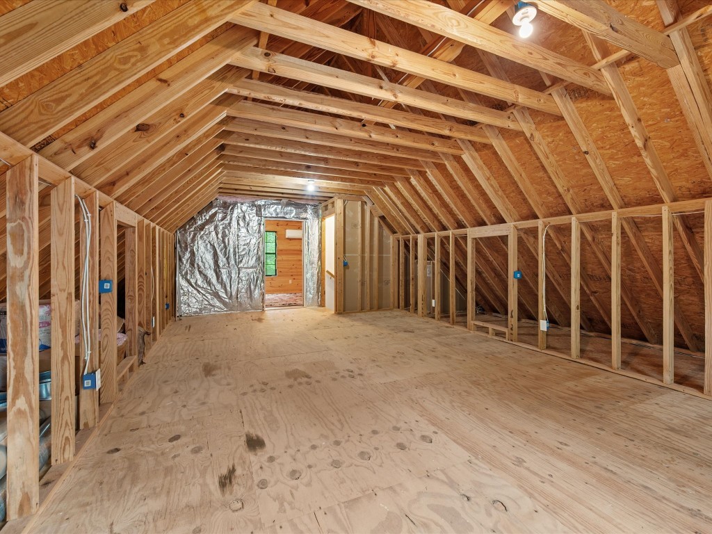 12868 Levi Road Willis, TX 77378 - Photo 27 of 41 Expansive storage space above the garage with endless potential for future customization or organization.