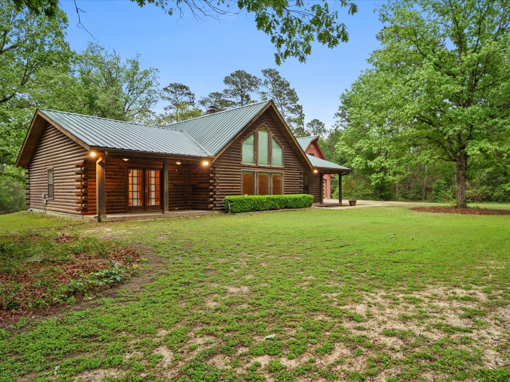 12868 Levi Road Willis, TX 77378 - Photo 29 of 41 Beautifully maintained log home on 10 private acres—offering timeless charm, peaceful surroundings, and room to roam.