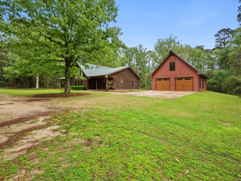 12868 Levi Road Willis, TX 77378 - Photo 31 of 41 Beautifully maintained log home on 10 private acres—offering timeless charm, peaceful surroundings, and room to roam.