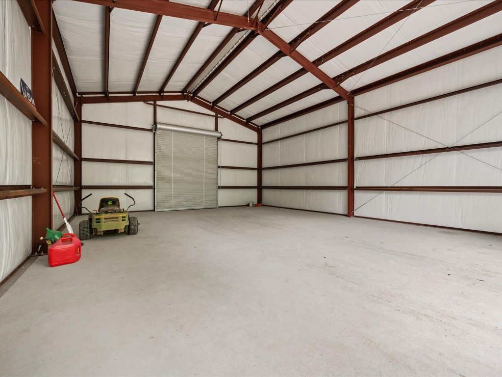 12868 Levi Road Willis, TX 77378 - Photo 5 of 41 Impressive 30x50 fully insulated shop—perfect for storage, hobbies, or workspace needs.