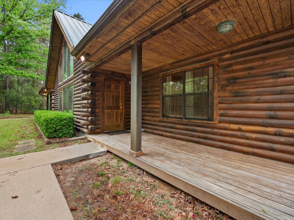 12868 Levi Road Willis, TX 77378 - Photo 8 of 41 From the moment you arrive, you’ll be drawn in by the inviting front porch and picturesque setting!