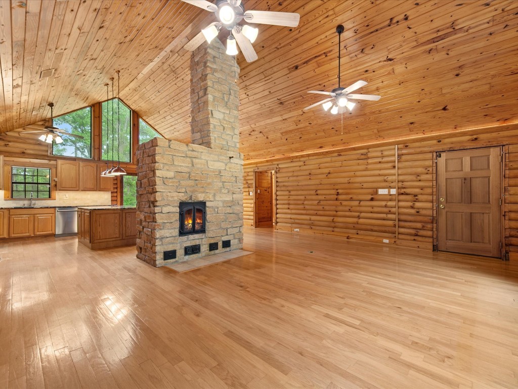 12868 Levi Road Willis, TX 77378 - Photo 10 of 41 Striking open living space centered around a custom masonry heater with built-in pizza oven—perfect for warmth, charm, and unforgettable gatherings.