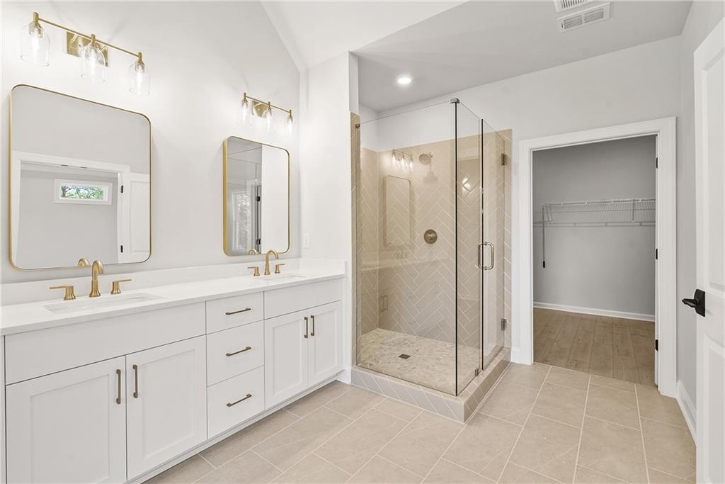 5715 Broad River View, Unit 449 Peachtree Corners, GA 30092 - Photo 26 of 29 a spacious bathroom with double sink and shower