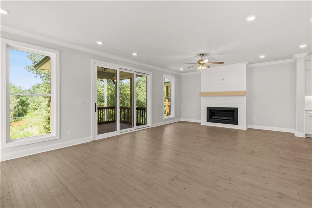 5715 Broad River View, Unit 449 Peachtree Corners, GA 30092 - Photo 29 of 29 an empty room with windows and fireplace