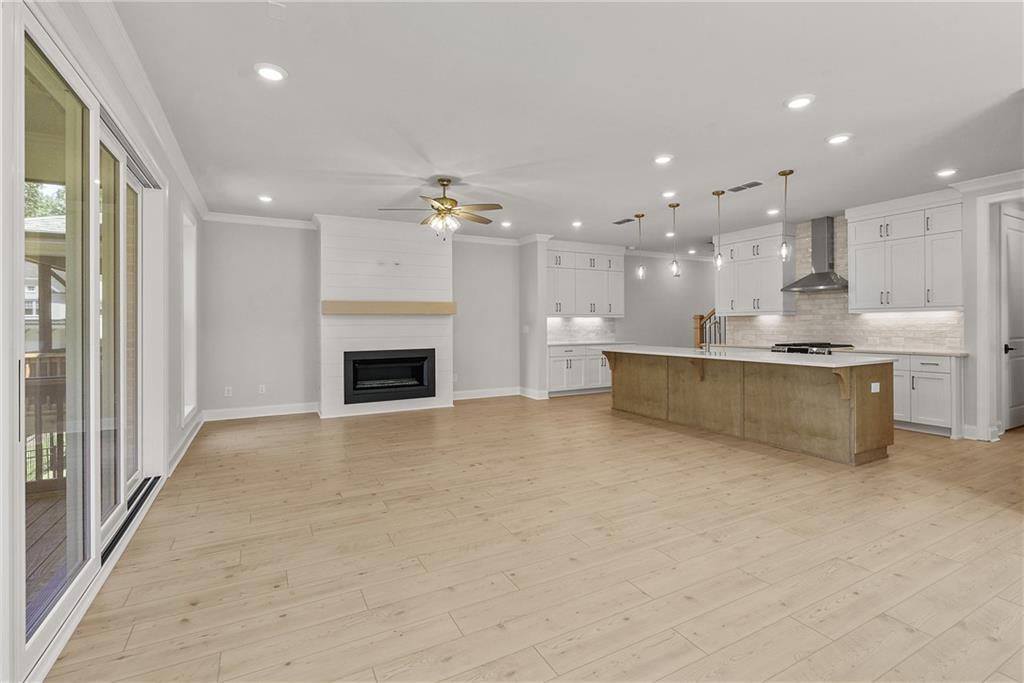 5715 Broad River View, Unit 449 Peachtree Corners, GA 30092 - Photo 4 of 29 a view of a kitchen with a sink and a fireplace