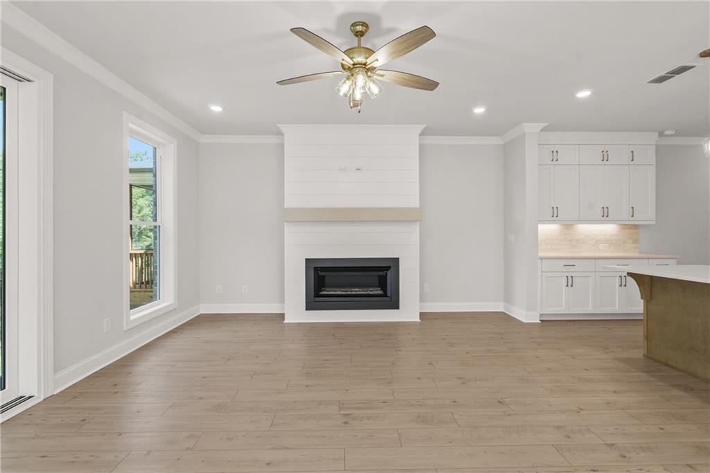 5715 Broad River View, Unit 449 Peachtree Corners, GA 30092 - Photo 5 of 29 a view of a kitchen with a sink and a fireplace