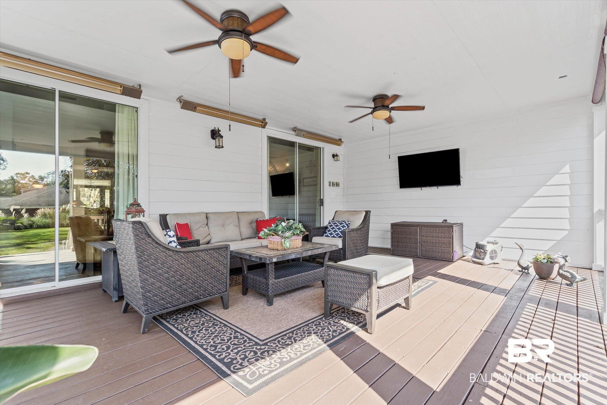 6175 South Grand Bay Wilmer Road Grand Bay, AL 36541 - Photo 21 of 42 Wooden terrace with an outdoor hangout area and ceiling fan