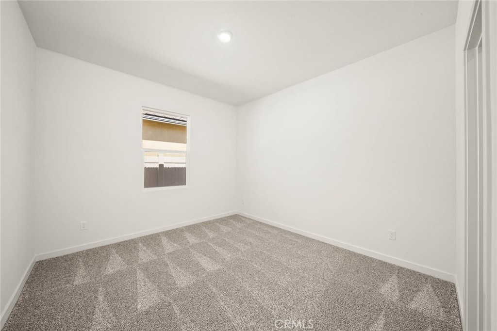80523 Anacapa Drive Indio, CA 92201 - Photo 14 of 17 an empty room with a window