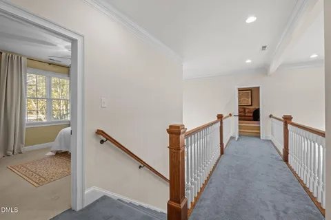 a view of a hallway with a bedroom