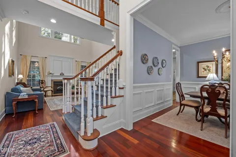 a view of entryway livingroom and hall with wooden floor