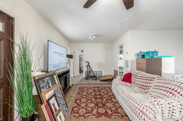 a bedroom with furniture and a book shelf